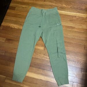 Green Nike sweat pants.